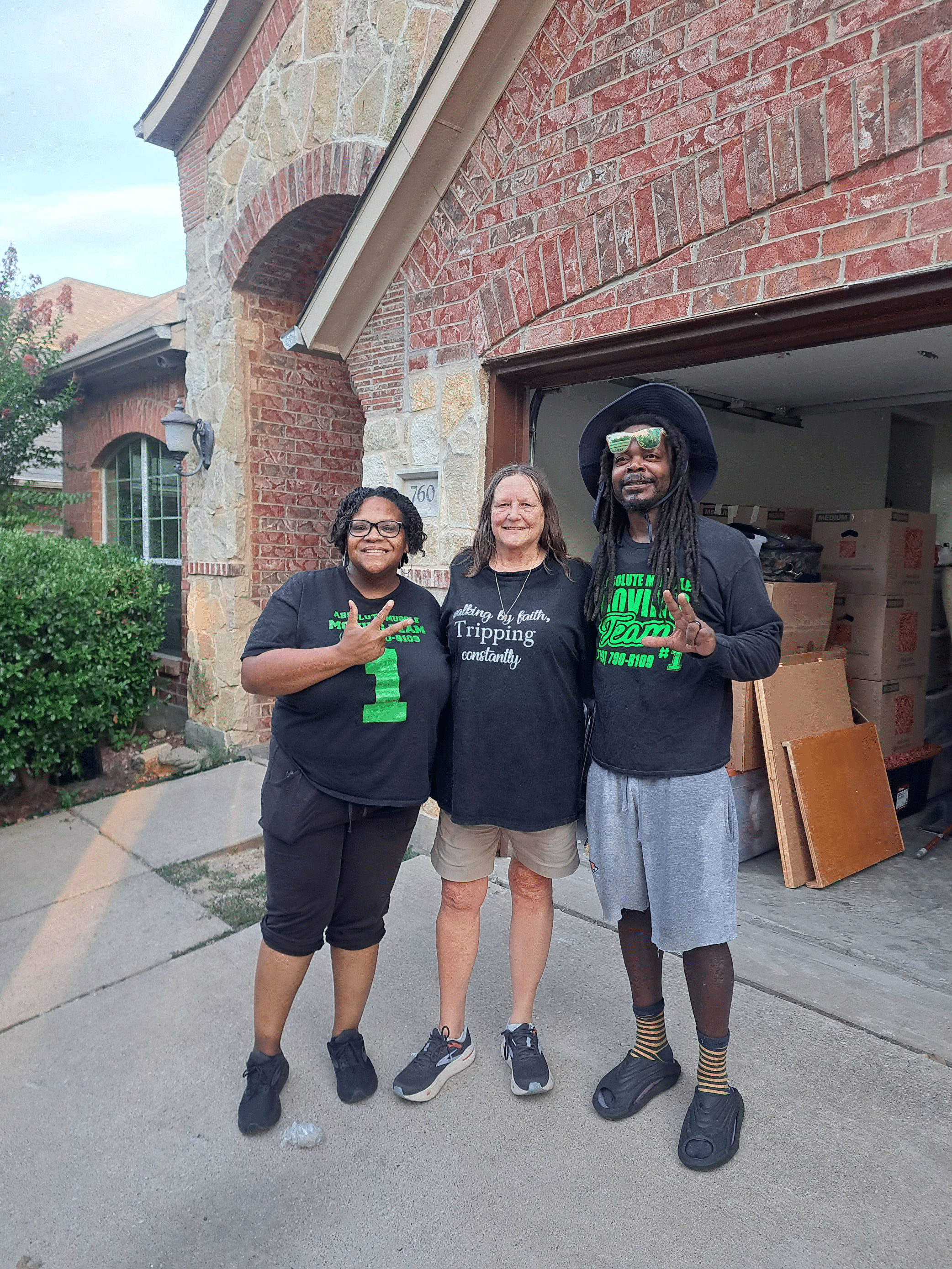 Experienced moving crew carrying furniture during a home relocation in Rogers AR
