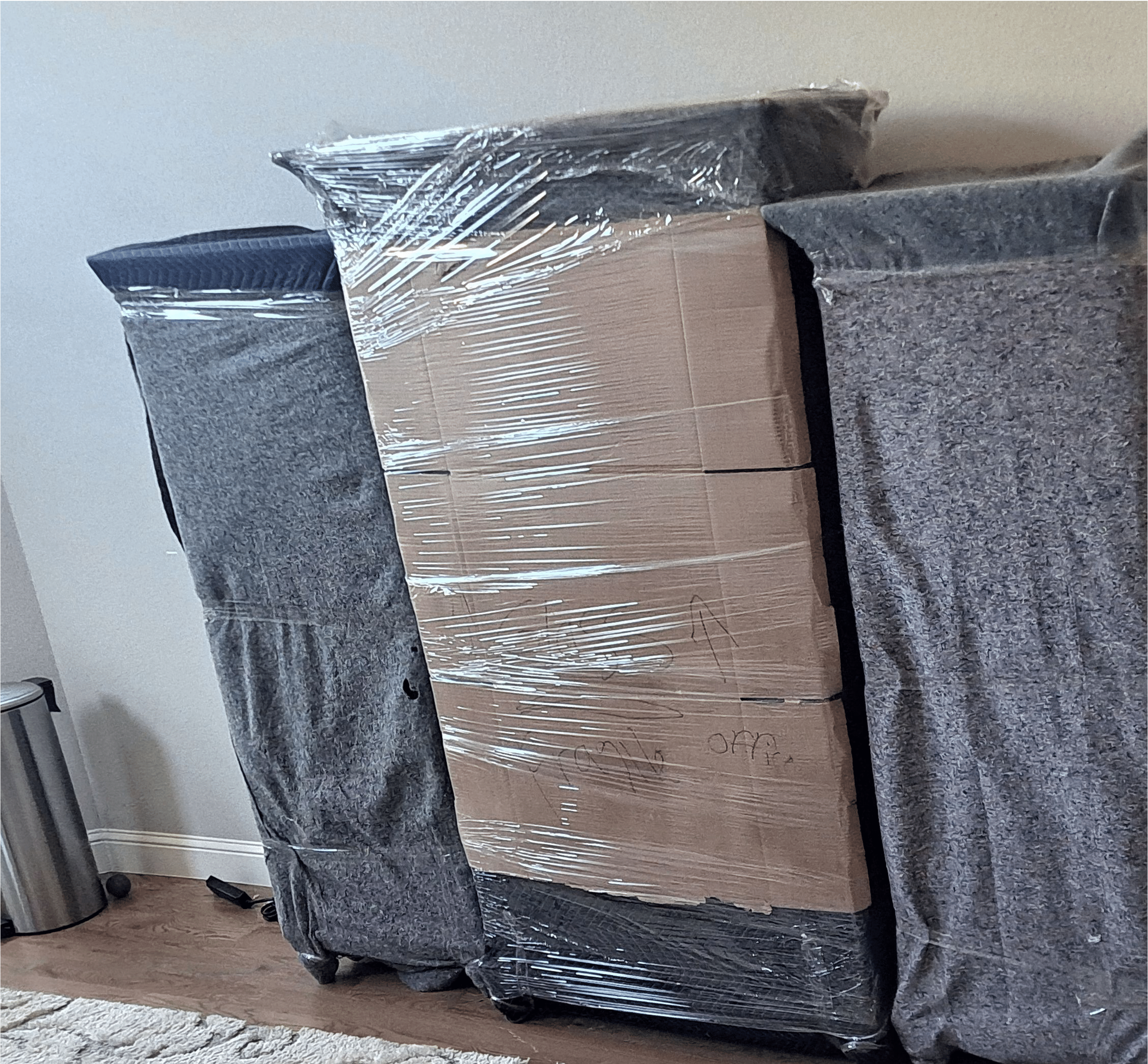 Moving crew assembling furniture after delivery at a customer home in Springdale AR