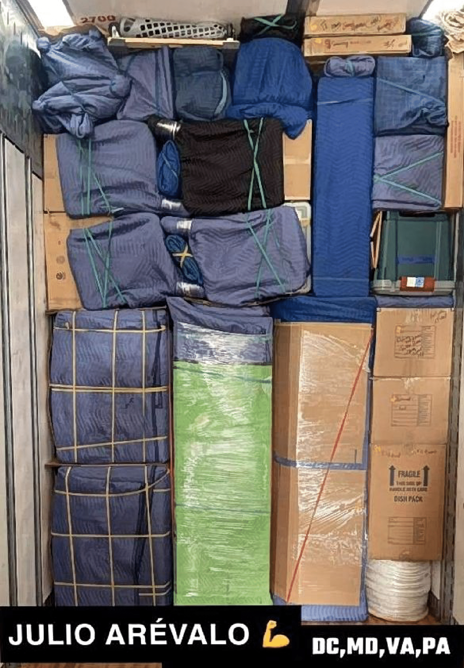 Professional movers placing furniture in a customer living room in Fayetteville AR