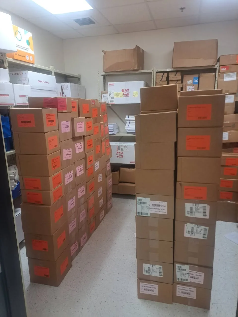 Labeled boxes stacked in a storage room